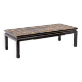 Lacquer coffee table decorated with floral motifs. Circa 1900.