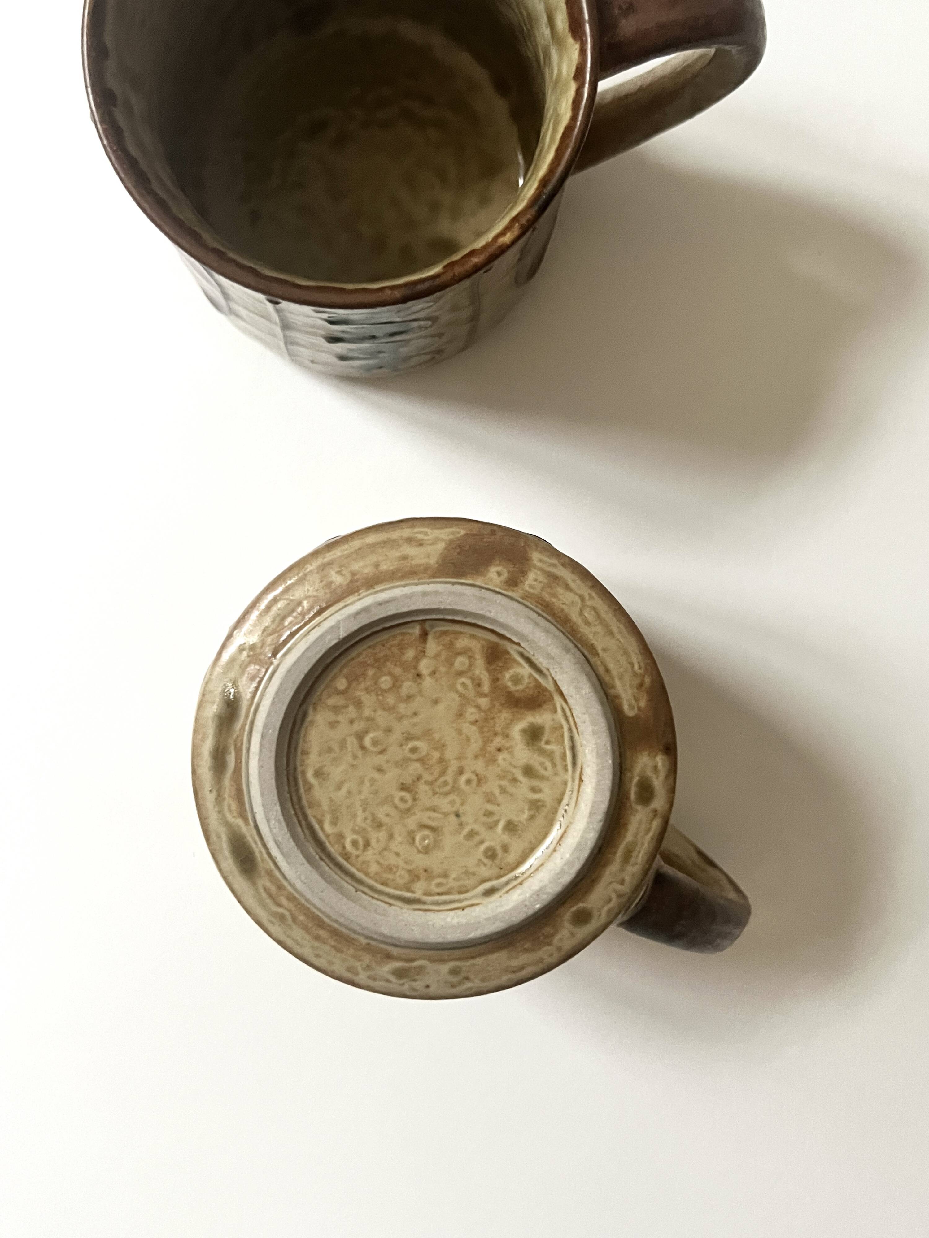 Set of 2 glazed ceramic coffee mugs from around 1970.