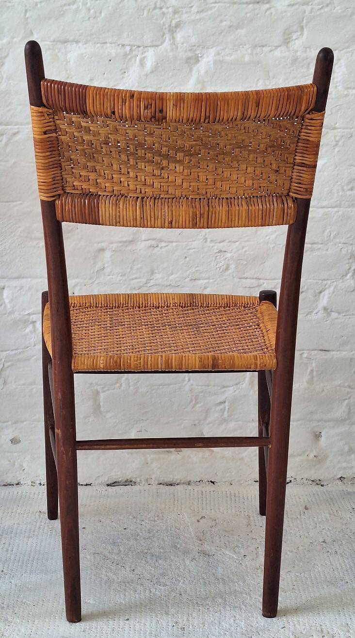 Four teak dining chairs with patinated cane after Gio Ponti, Italy 1960s