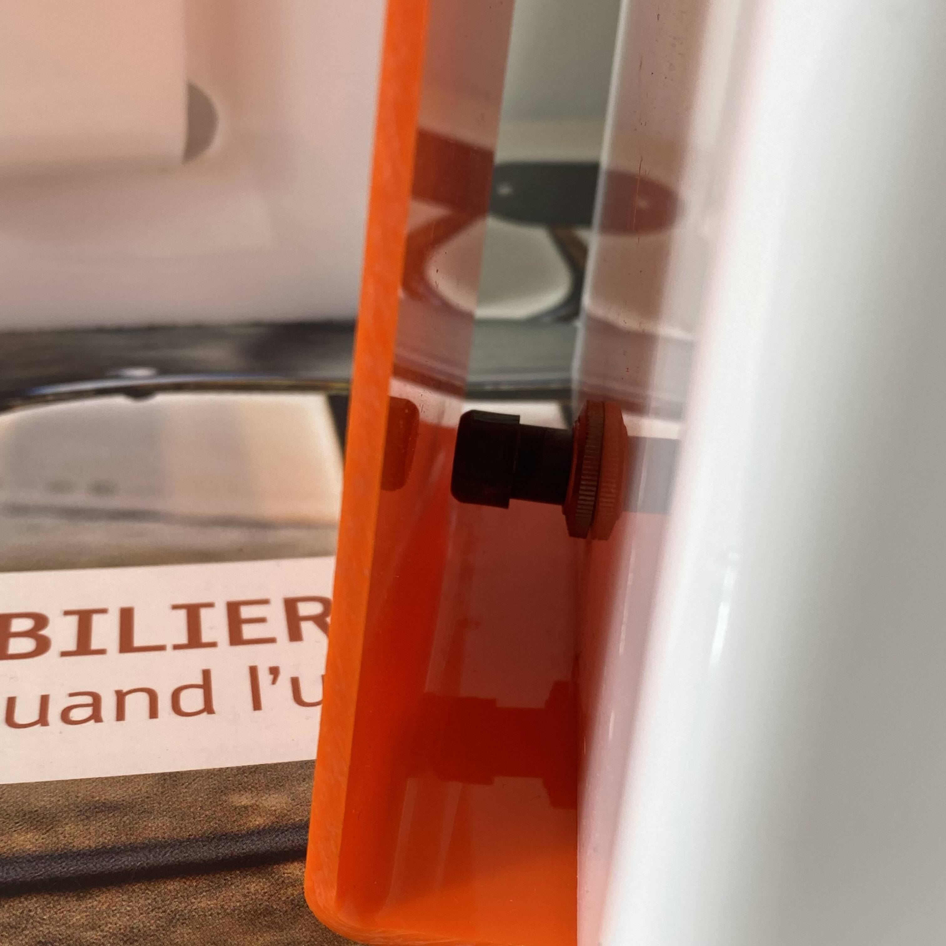 Pair of orange plexiglass wall sconces from the seventies.