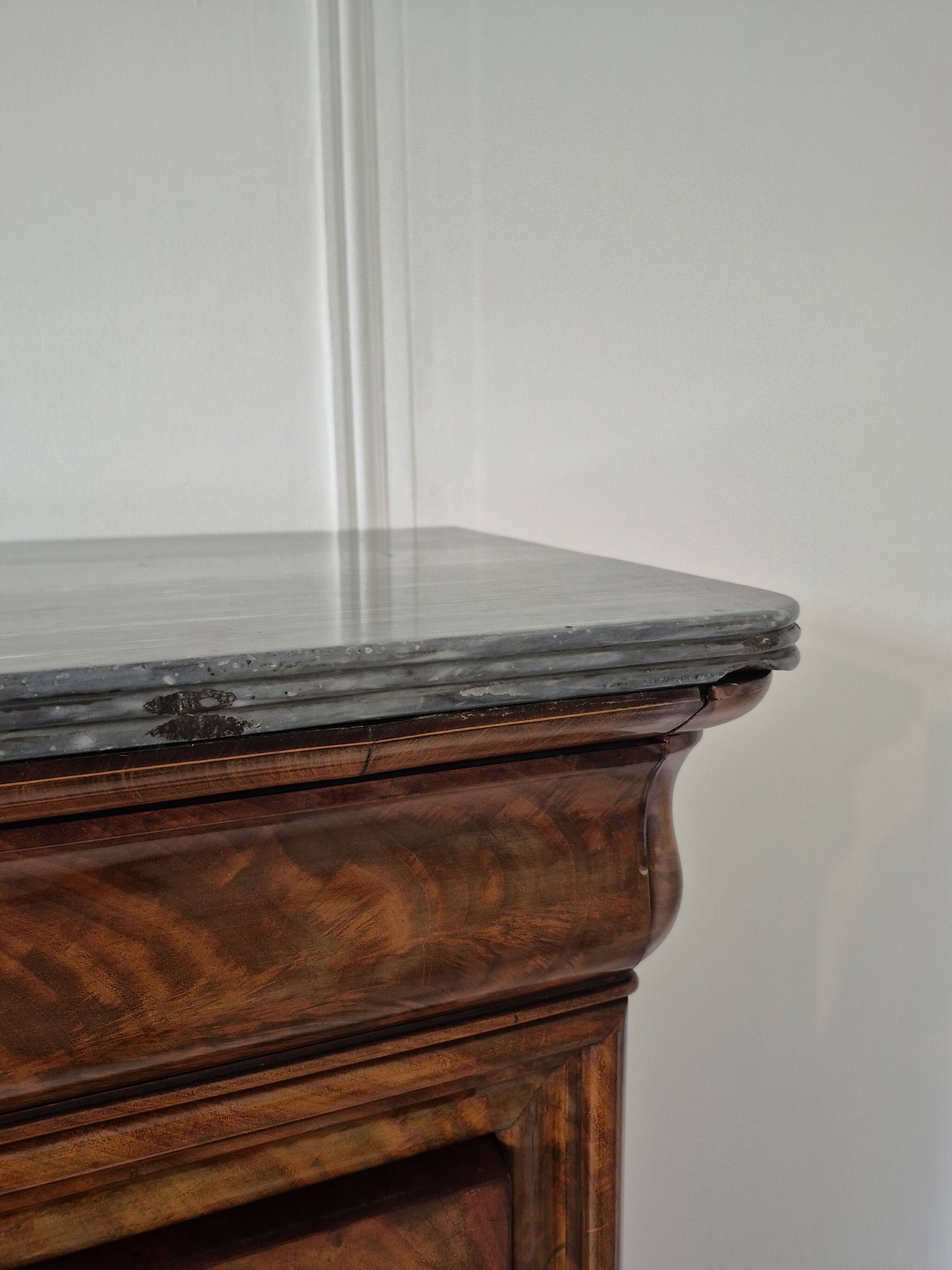 Mahogany secretary desk with marble top and interior mirror.