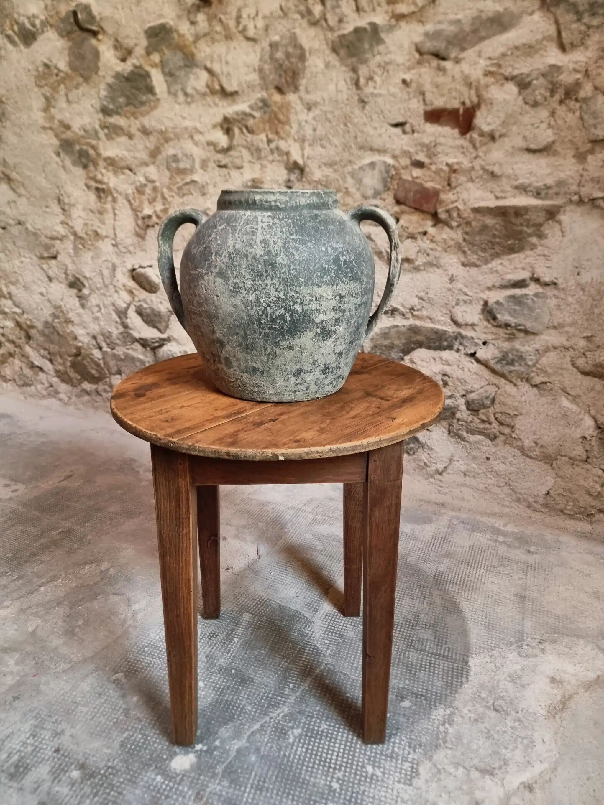 Antique round side table with oak legs and a pine top, circa 1900.