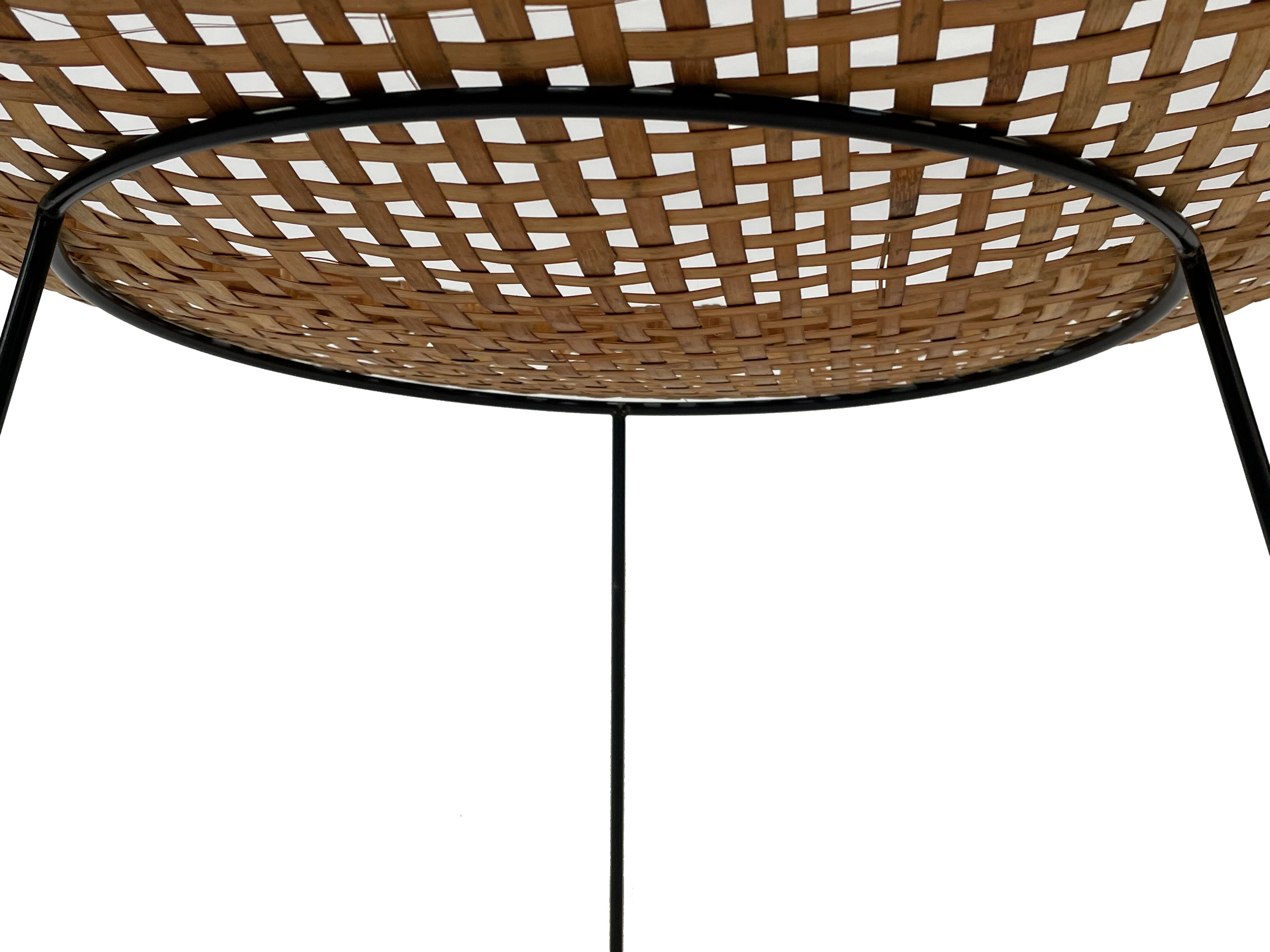 Rattan magazine rack on black metal frame, Artimeta, 1950