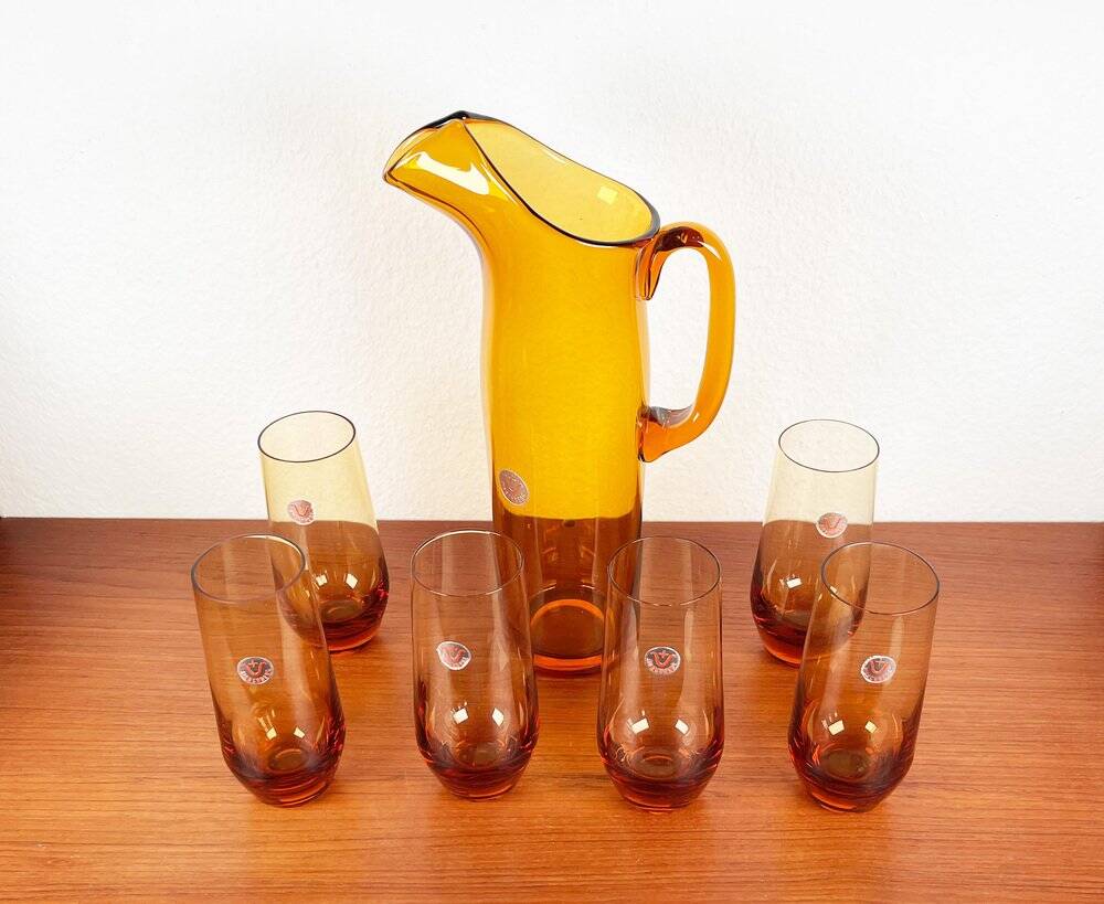 Amber glass carafe from the mid-century German Jagdhaus series and drinking glasses by Wilhelm Braun-Feldweg for Hirschberg, 1960s, set of 7.
