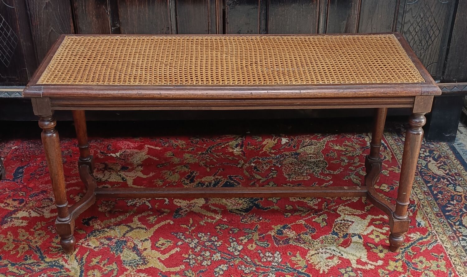 Wooden bench or piano bench with tanned seat