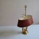 hot water bottle lamp with 2 bronze lights and burgundy sheet metal lampshade