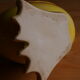 Ceramic watering can in white earthenware, yellow enamel and bird shape