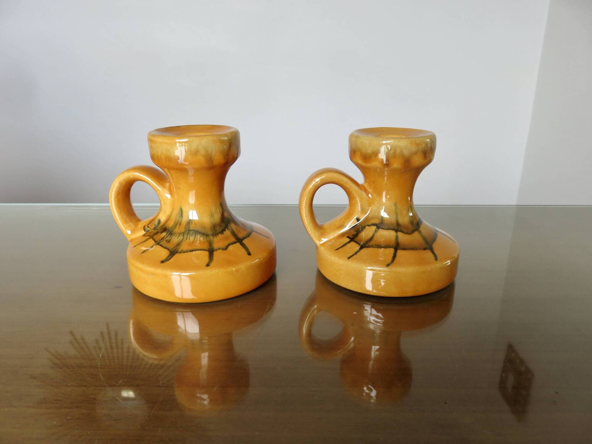 Pair of orange ceramic candlesticks from the 60s