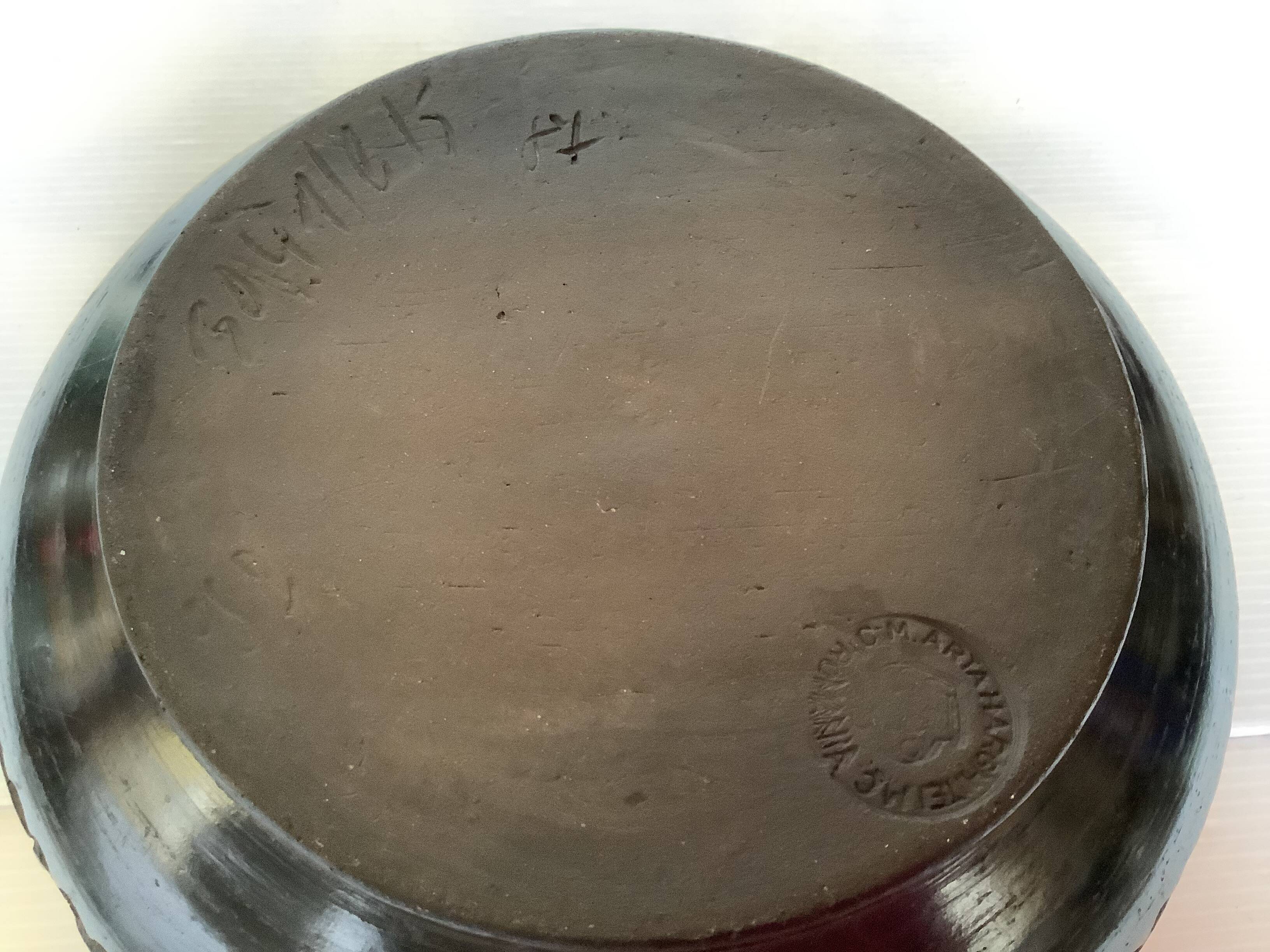 Black pottery catchall worked from Marginea, Romania.
