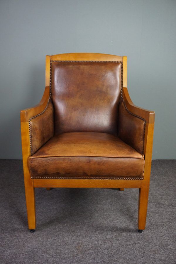 Armchair in sheepskin with beautiful light wood