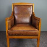 Armchair in sheepskin with beautiful light wood