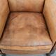 Vintage sheepskin armchair with a beautiful light colour and elegant legs