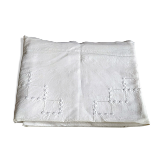 White linen drape embroidered
