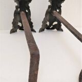 Pair of bronze andirons with black patina, 19th century, female caryatids