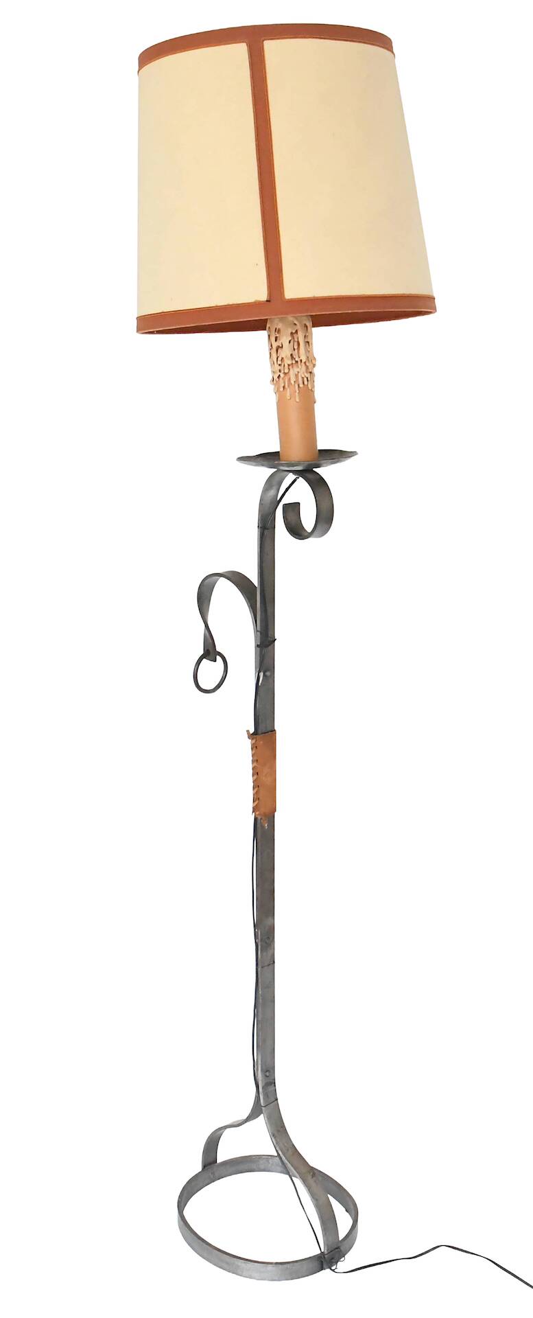Wrought iron and leather floor lamp in the style of Jean-Pierre Ryckaert.