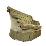 Vintage green two-seater sofa with fringes