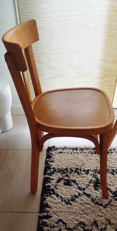 Set of 4 light wood bistro chairs stamped Baumann and Thonet.