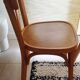 Set of 4 light wood bistro chairs stamped Baumann and Thonet.