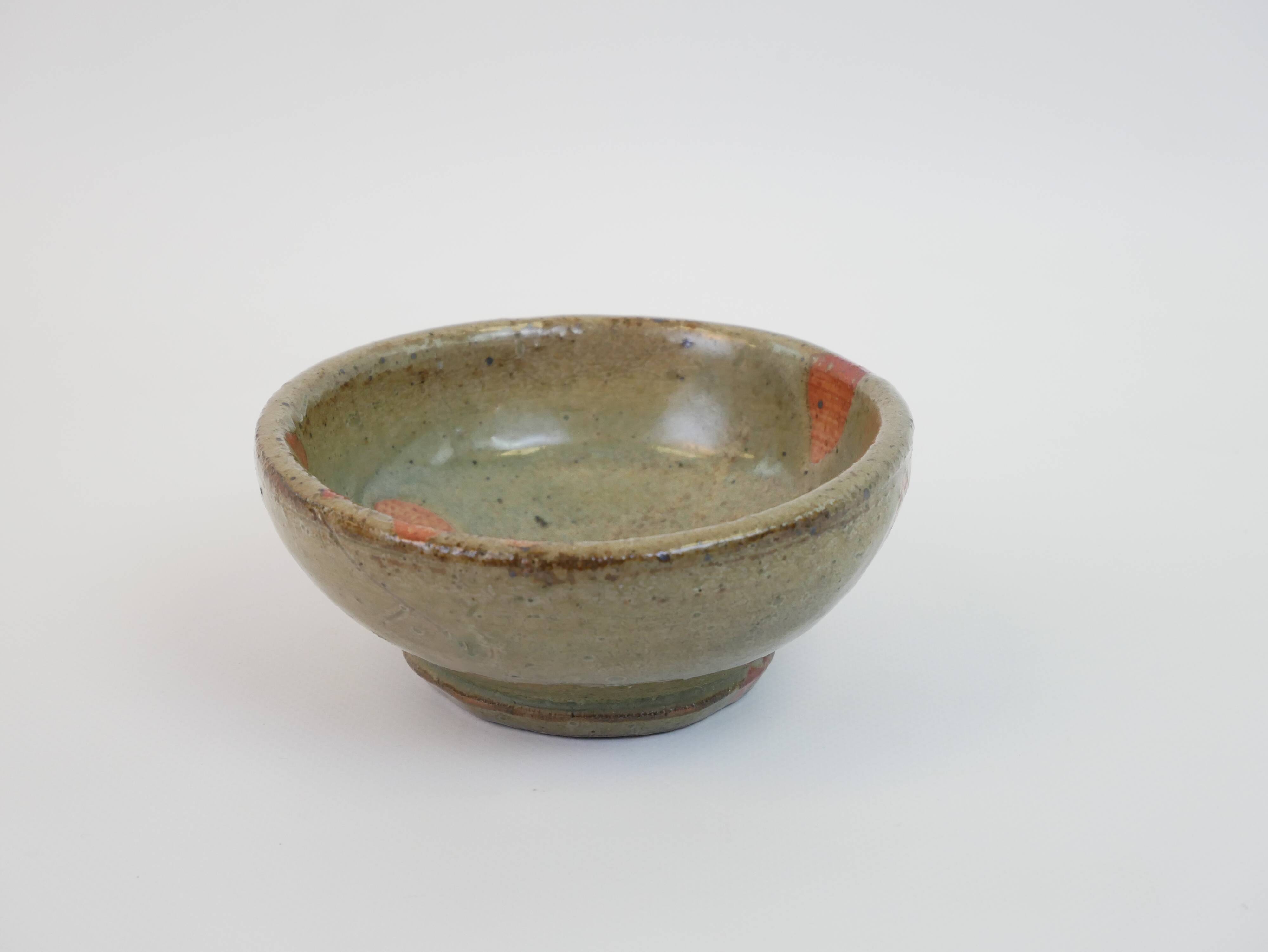 Small bowl in water green glazed ceramic with coral pink pattern