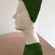 Bust of a woman in green and white plaster