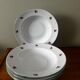 Set of 5 deep porcelain plates in cherry table colours.