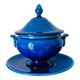 Blue ceramic soup tureen and crackled finish trivet.