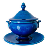 Blue ceramic soup tureen and crackled finish trivet.