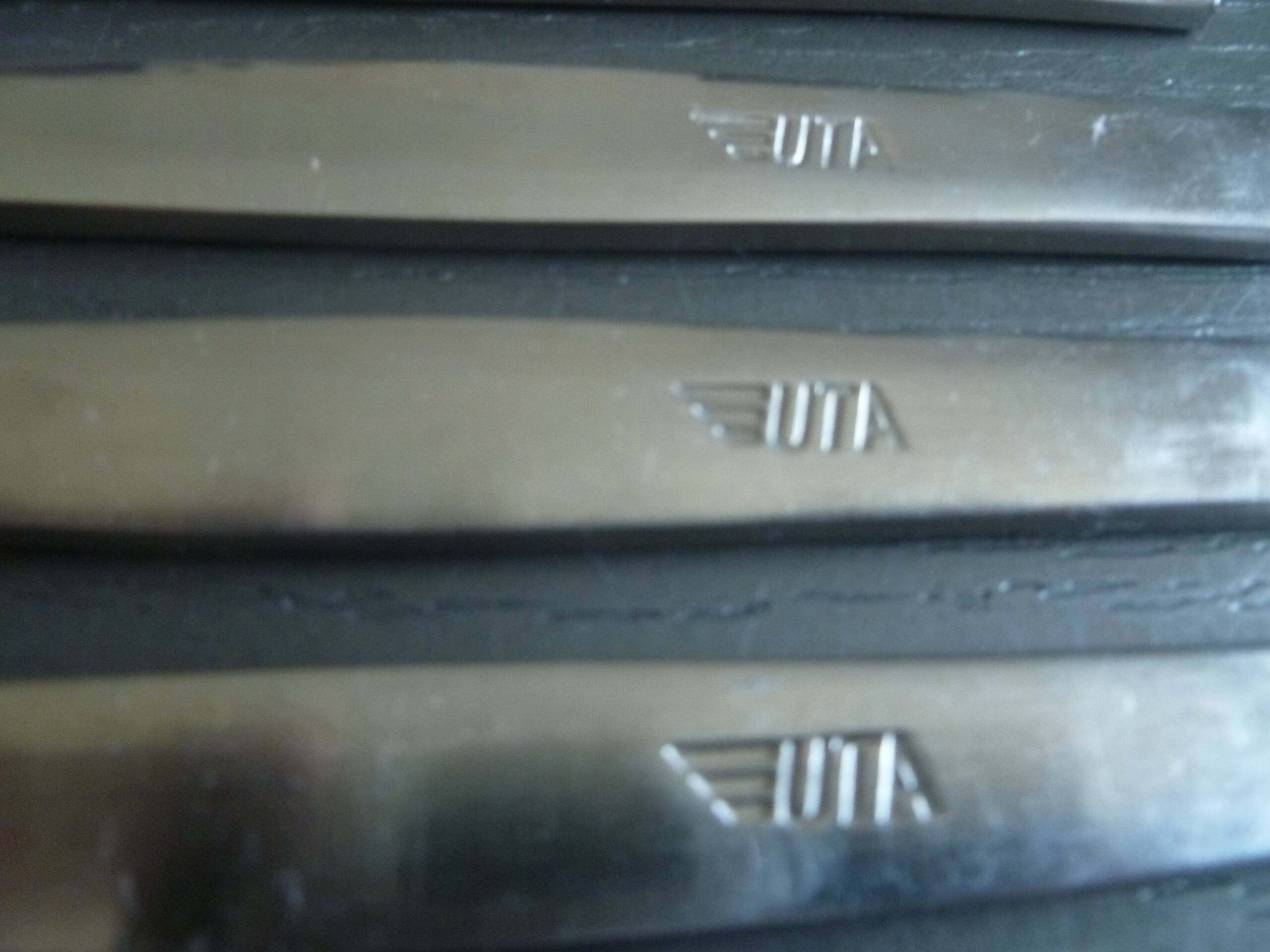 Set of 12 UTA stainless steel knives, vintage