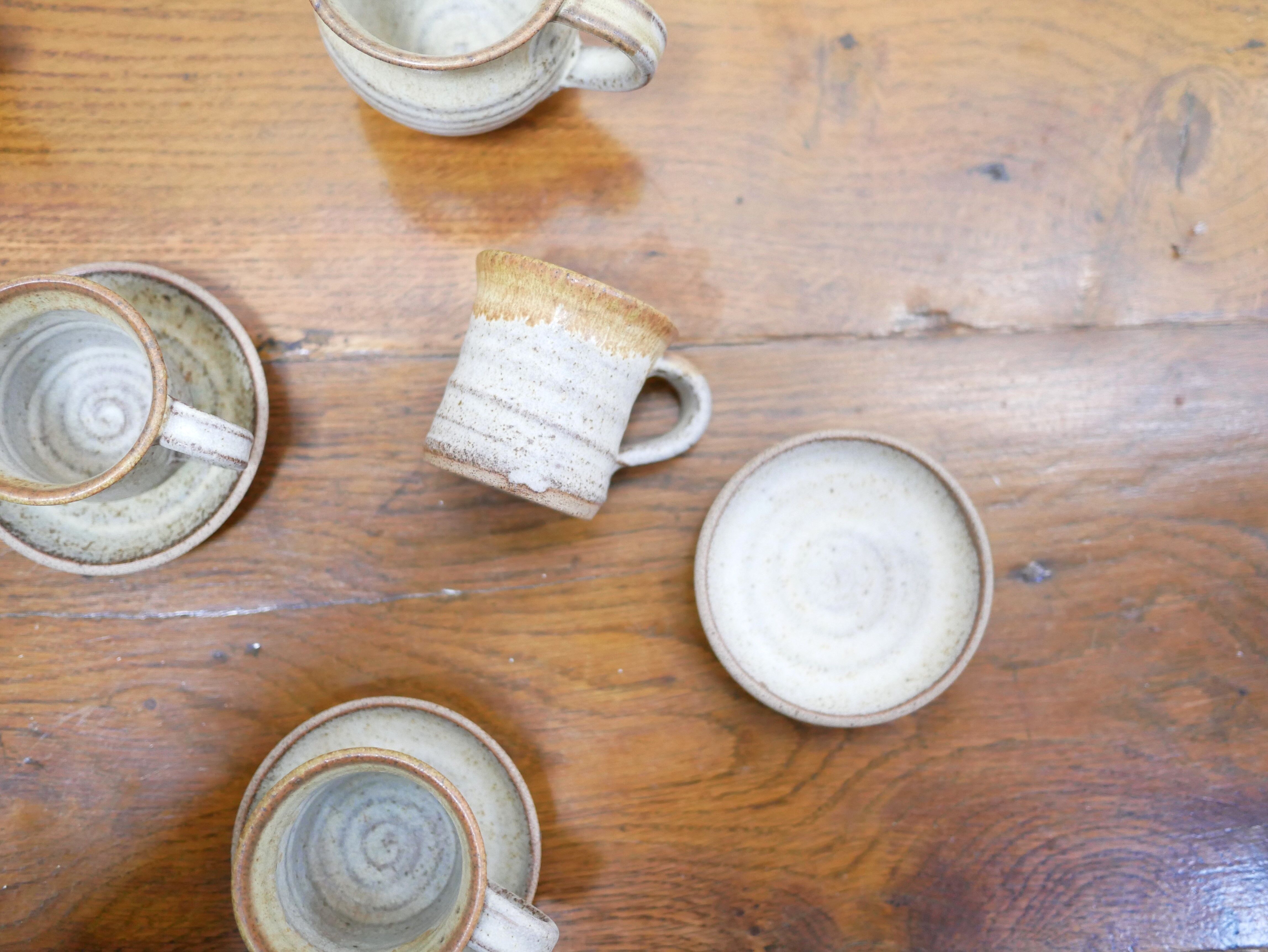 Series of 4 cups and a vintage stoneware milk jug