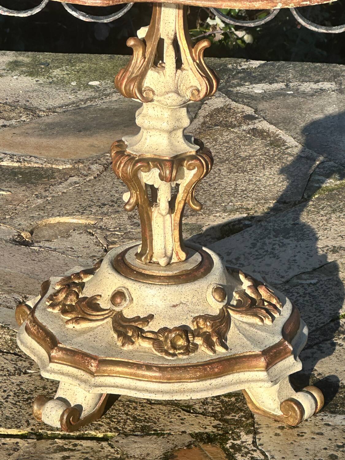 Carved and lacquered wooden side table.