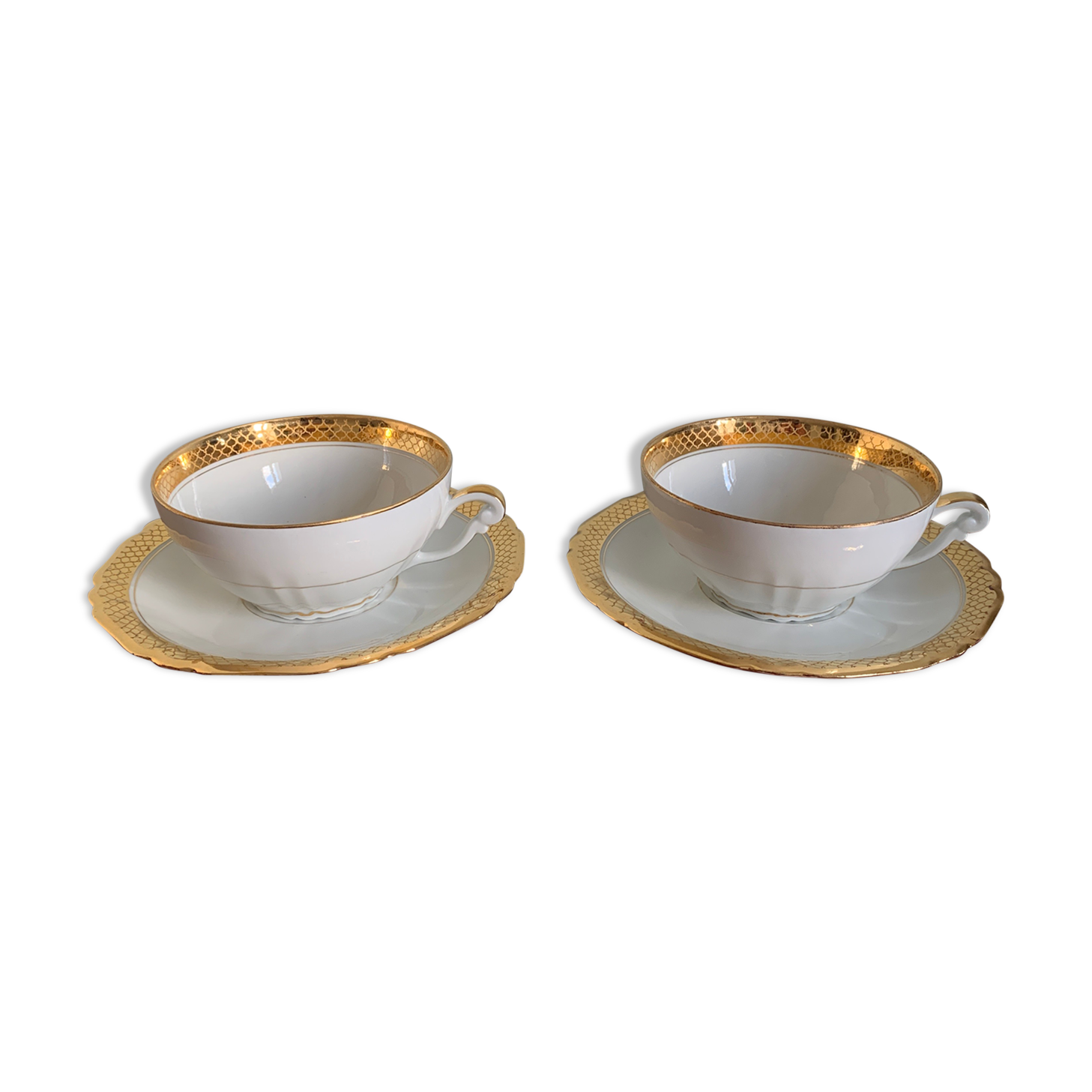 Pair of gold porcelain tea cups
