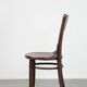 Chaise bistro en bois vintage intemporelle Cosmos avec de magnifiques sculptures.