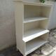 Vintage library enhanced in beige, wooden top.