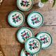 Set of 7 vintage Badonvilier dessert plates.
