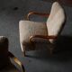 Pair of Mid Century Modern Swedish lounge chairs in birch and lamb's wool, 1960s.