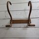 Curved wooden coat rack with 2 hooks, 1920s.
