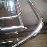 Chrome and smoked glass serving in the year 70