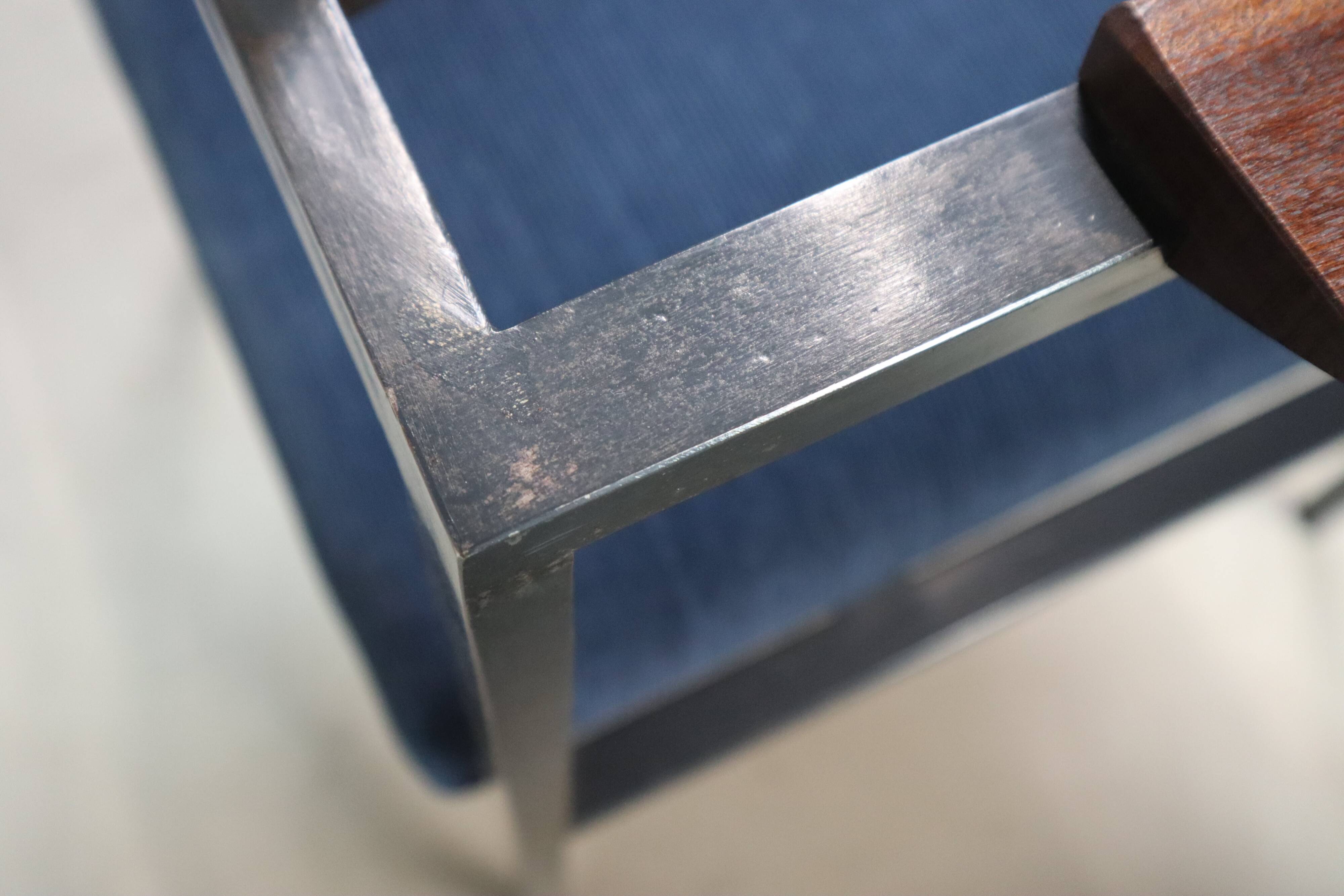 Pair of Postmodern armchairs in steel and mahogany, 1970s