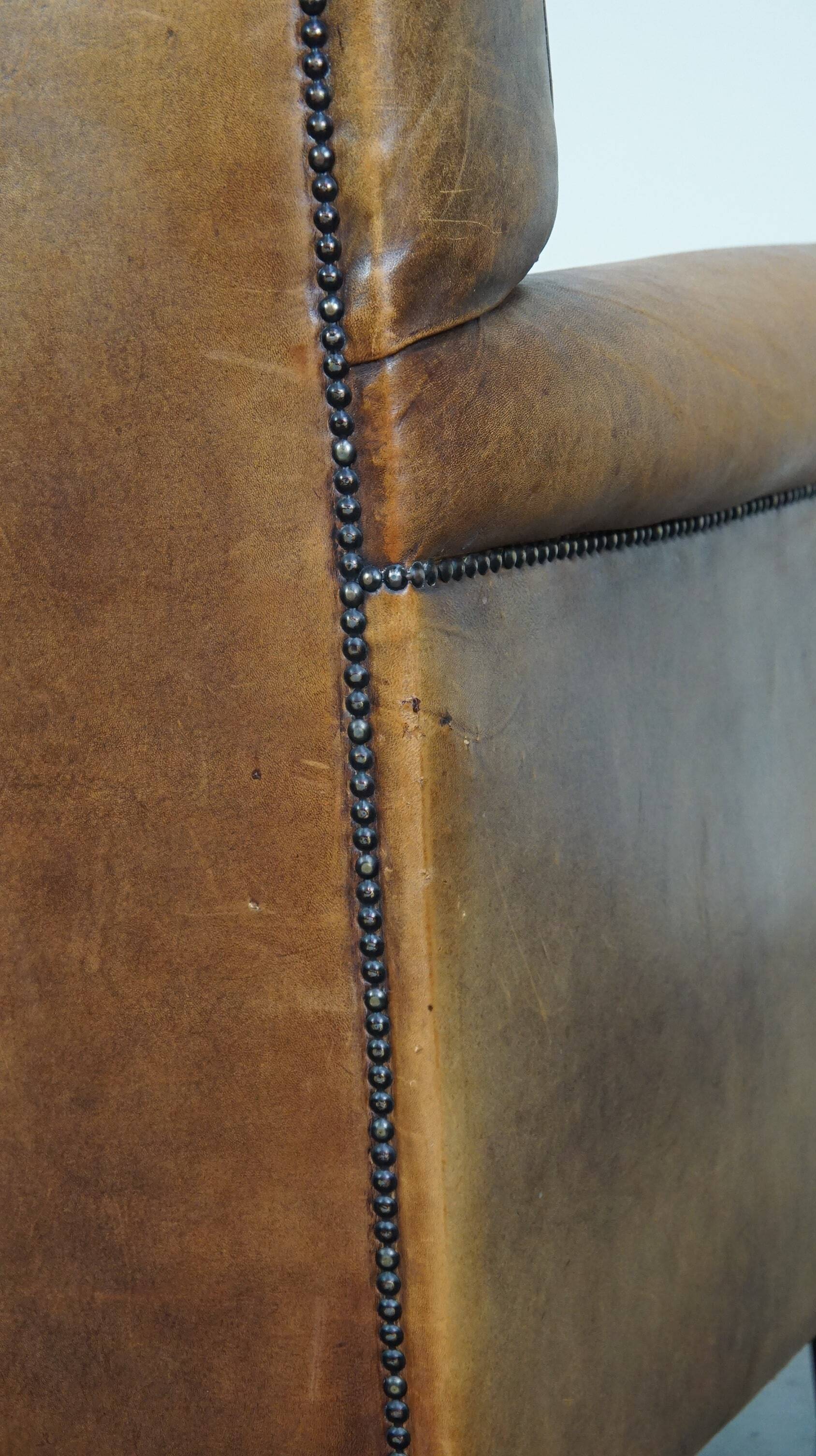 Stately, sleekly finished, comfortable sheepskin armchair