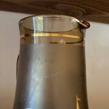 Vintage smoked glass carafe with gold from the 50s/60s, featuring a marine and water skiing design.