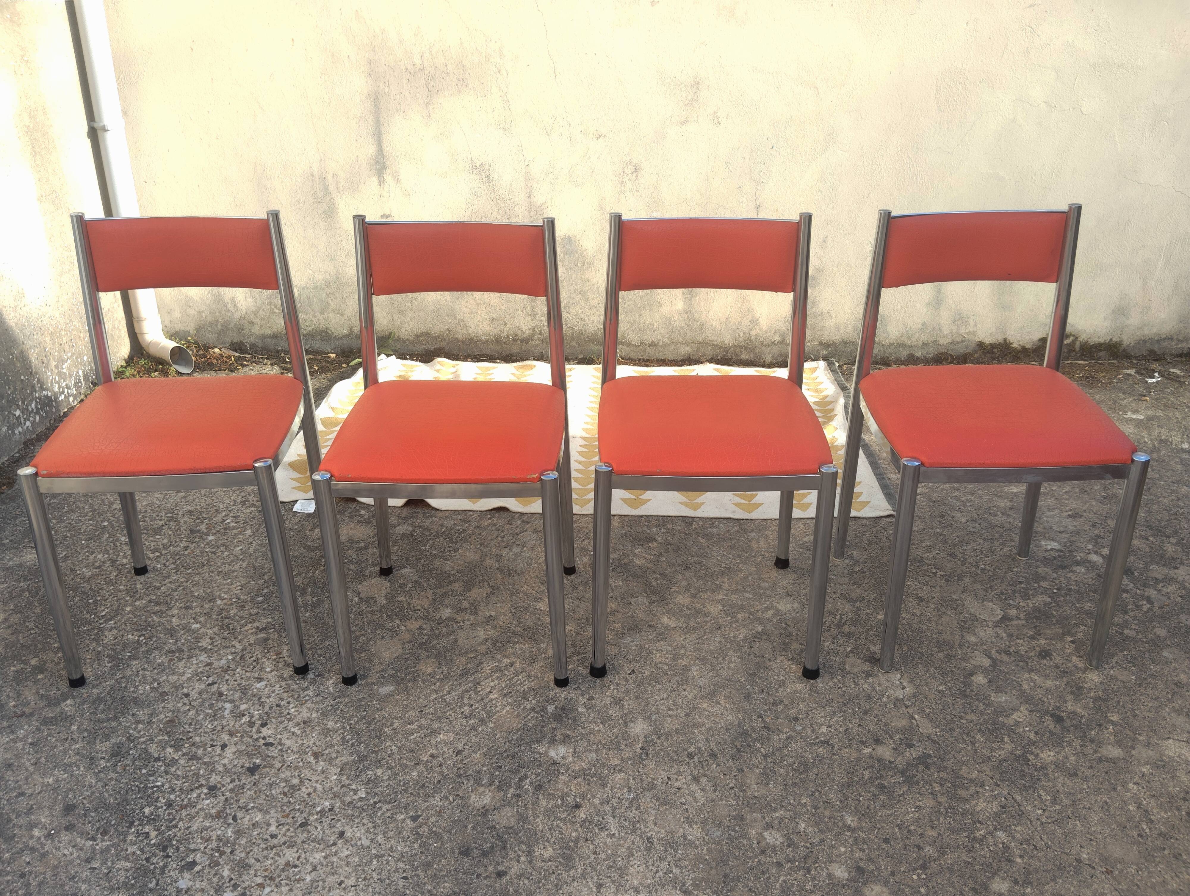 Set of 4 vintage chrome and orange faux leather chairs.