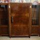 Important Art Deco library in amboyna and mahogany veneer.