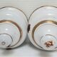 Four white enamelled metal cheese bells early twentieth century