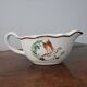 Digoin Sarreguemines sauceboat with hand-painted waterfowl decoration