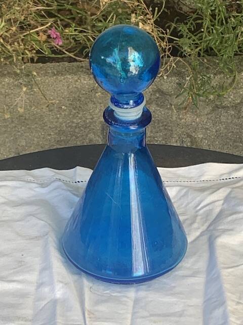 Blue bottle, glass vial for vintage perfume or liqueur.