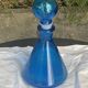 Blue bottle, glass vial for vintage perfume or liqueur.