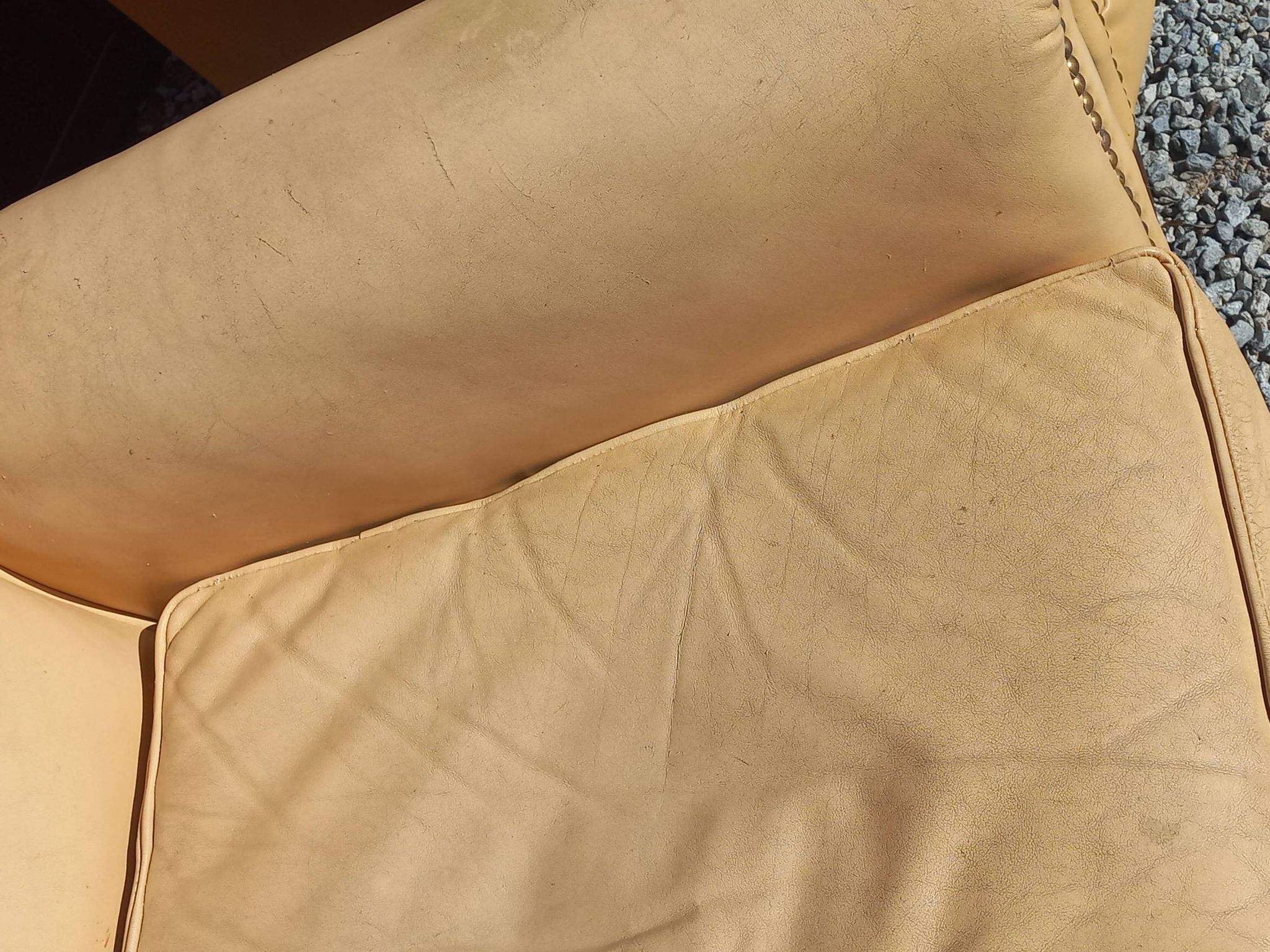 Pair of 1930s club armchairs in ivory leather.