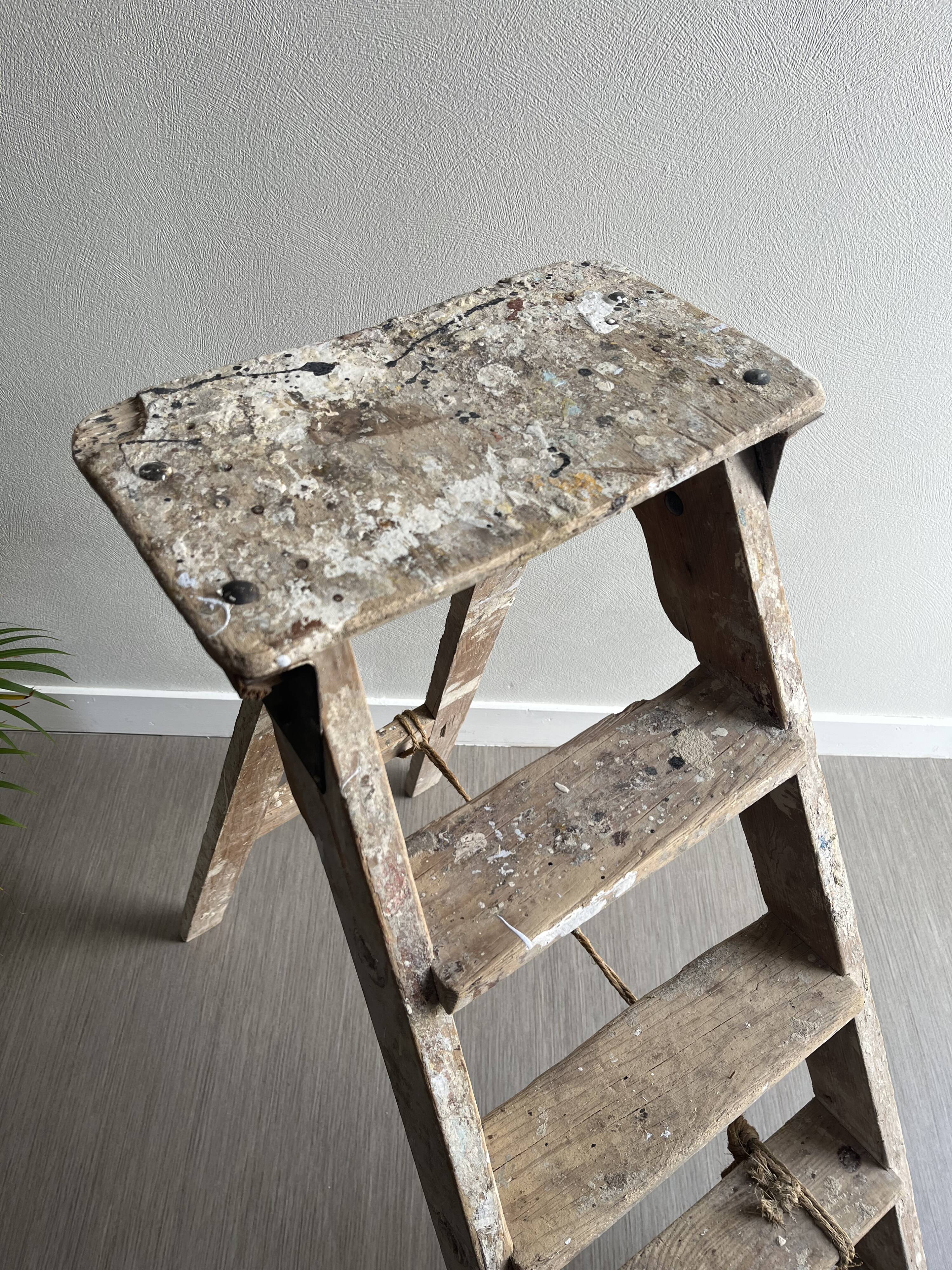 Former stepladder of patinated wood painter