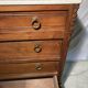 Antique carved wooden dressing table with marble and tilting oval mirror.