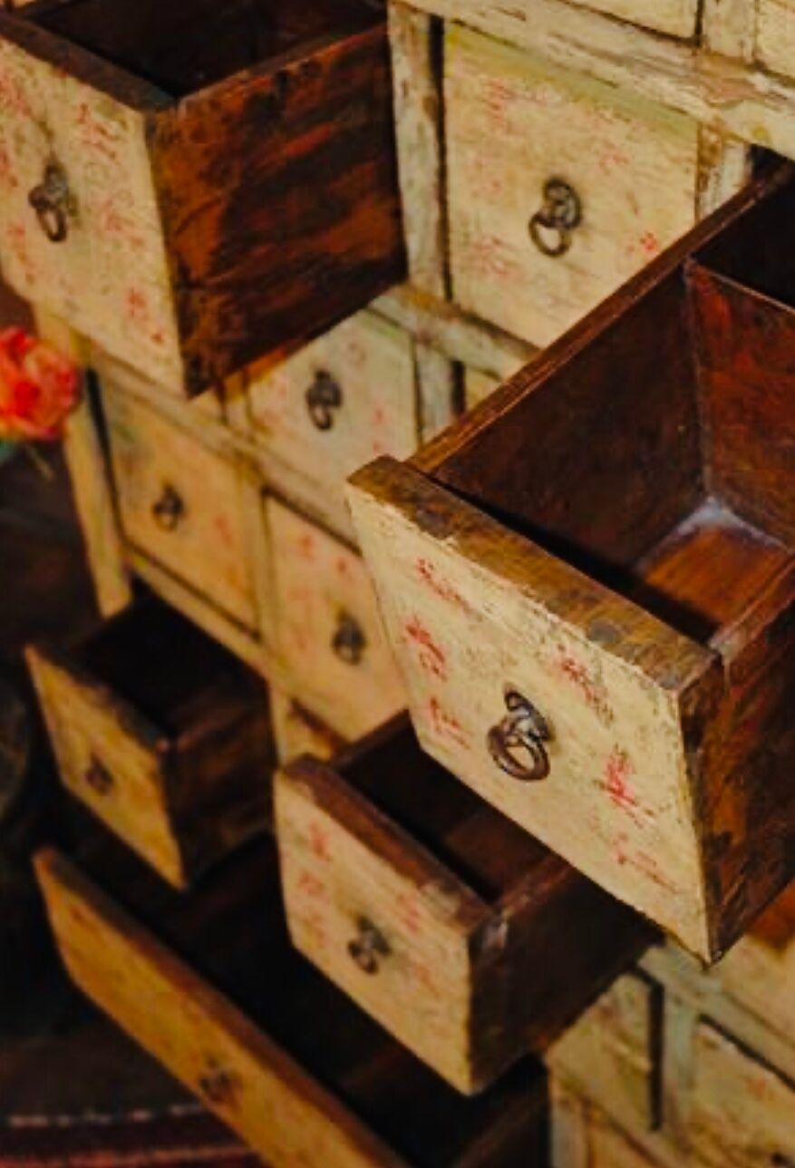 Antique Chinese apothecary cabinet with calligraphy